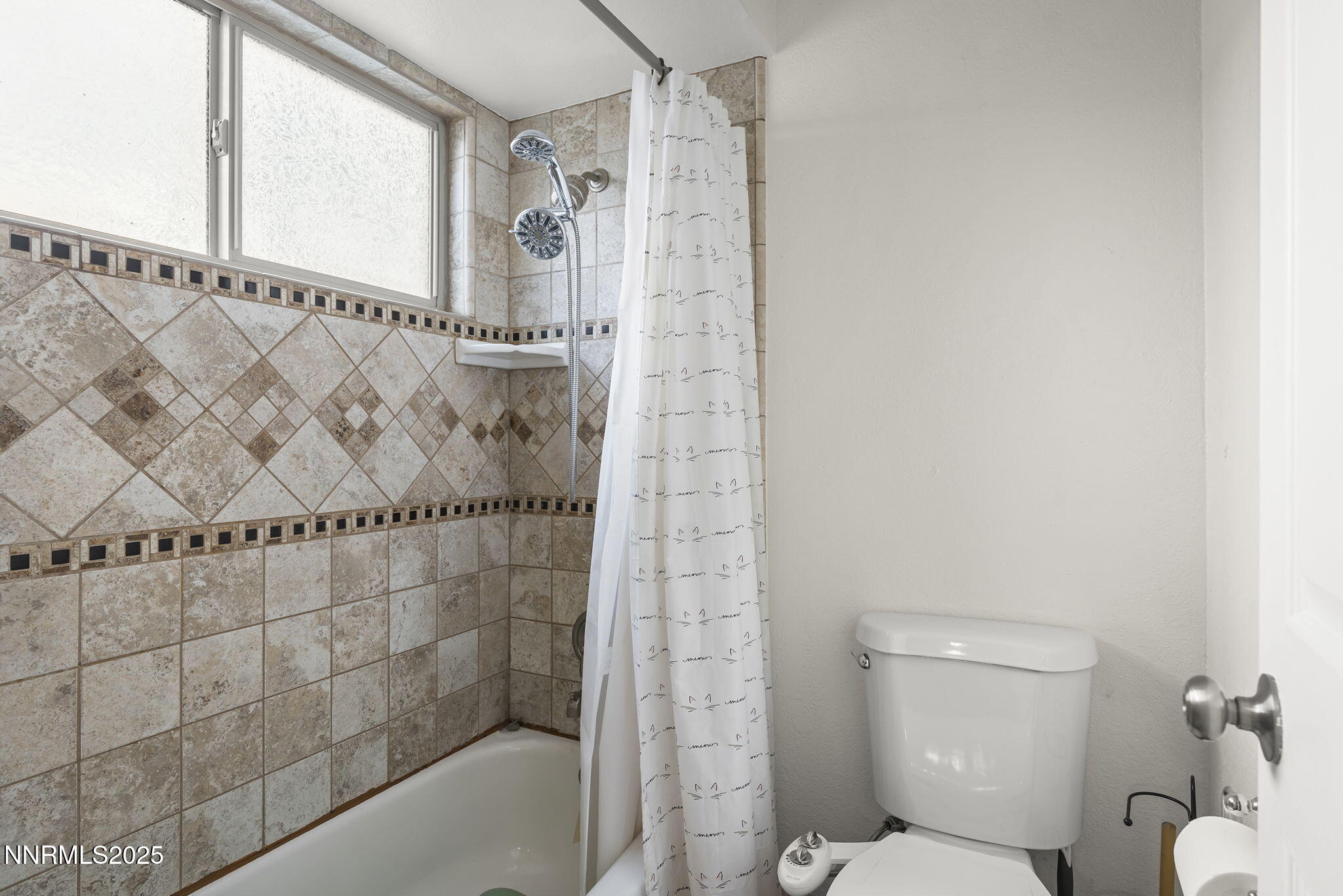 1023 Tyler Way Sparks, NV 89431 - Photo 19 of 21 a bathroom with a shower and a toilet