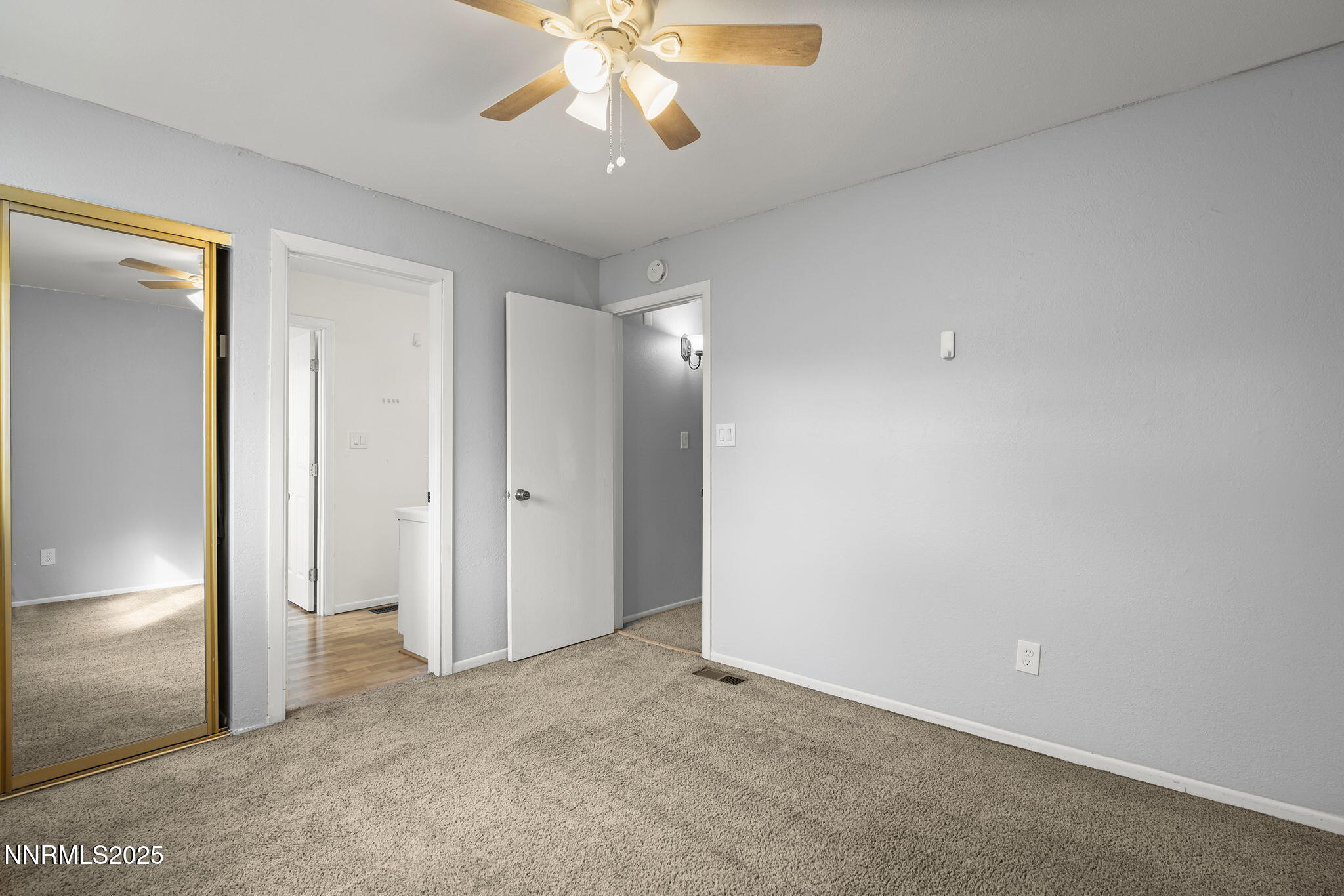 1023 Tyler Way Sparks, NV 89431 - Photo 21 of 21 a view of an empty room with a chandelier fan