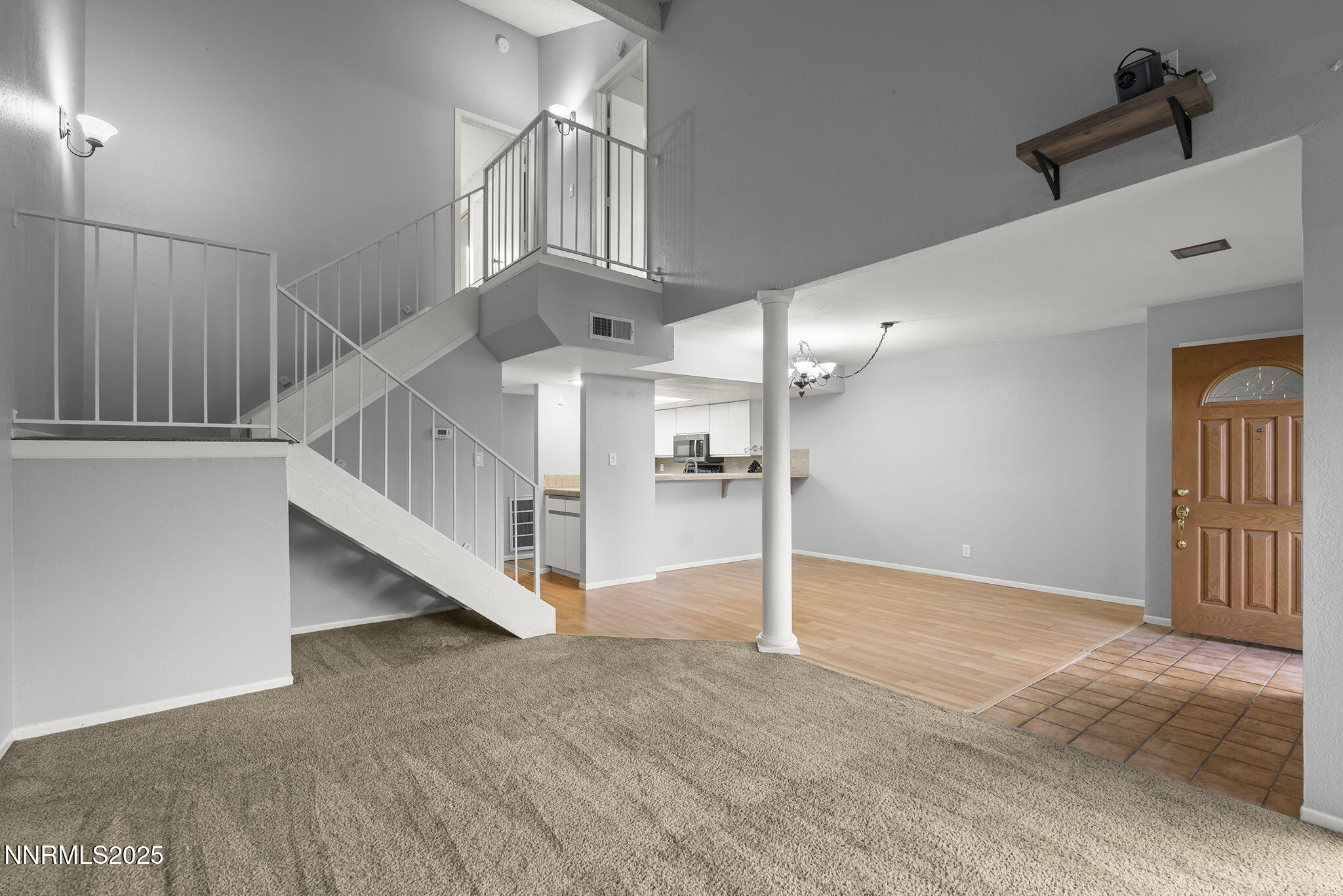 1023 Tyler Way Sparks, NV 89431 - Photo 6 of 21 a view of an entryway wooden floor and a living room