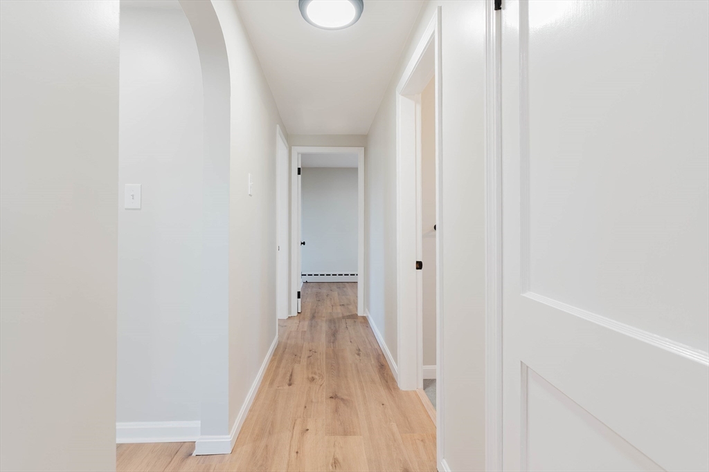 28 Thompson Road Webster, MA 01570 - Photo 8 of 30 a view of a room with wooden floor