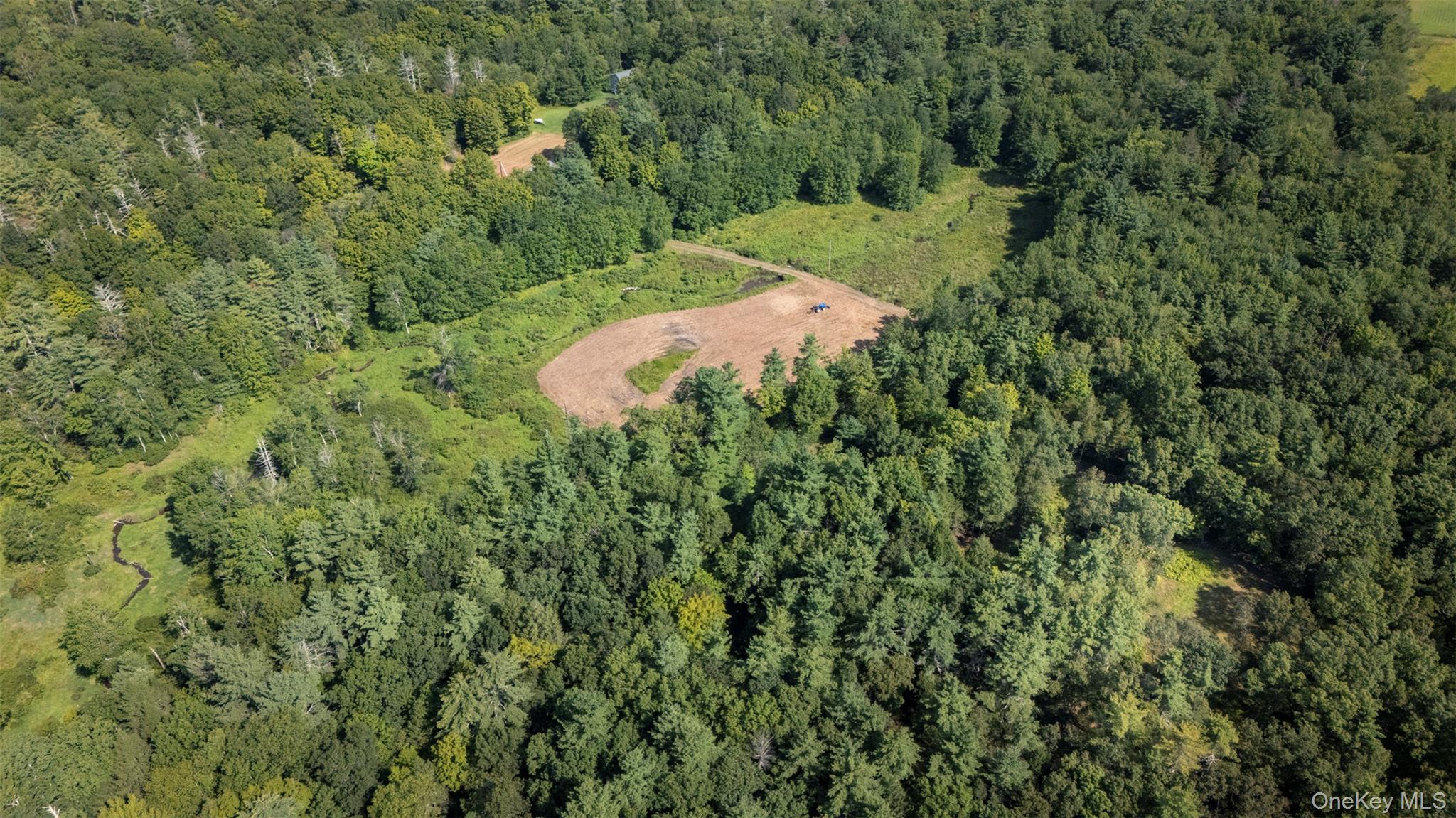 327 Phillips Road Saugerties, NY 12477 - Photo 21 of 24 Aerial view of property's location featuring a heavily wooded area