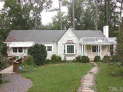 2716 Rosedale Avenue Raleigh, NC 27607 - Photo 1 of 1 a front view of a house with a yard