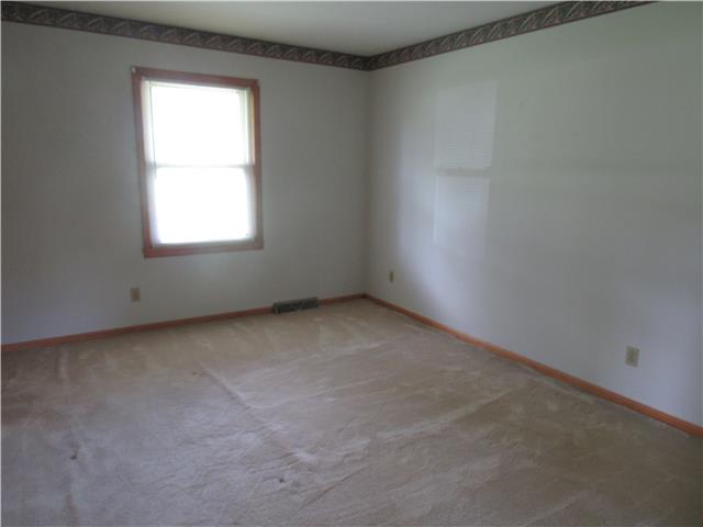 940 Steele Road Charlotte, TN 37036 - Photo 14 of 16 one of three bedrooms