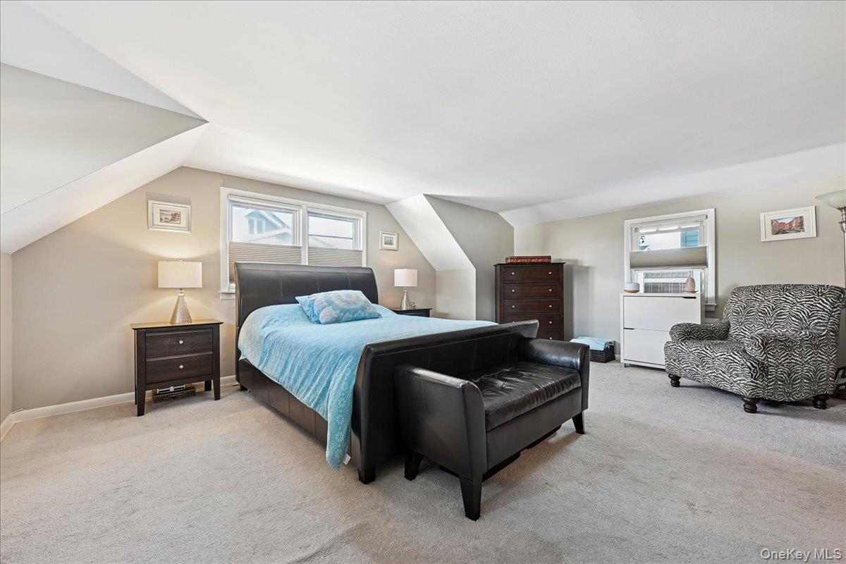 4 East Carpenter Street Valley Stream, NY 11580 - Photo 22 of 34 a bedroom with a bed and a couch