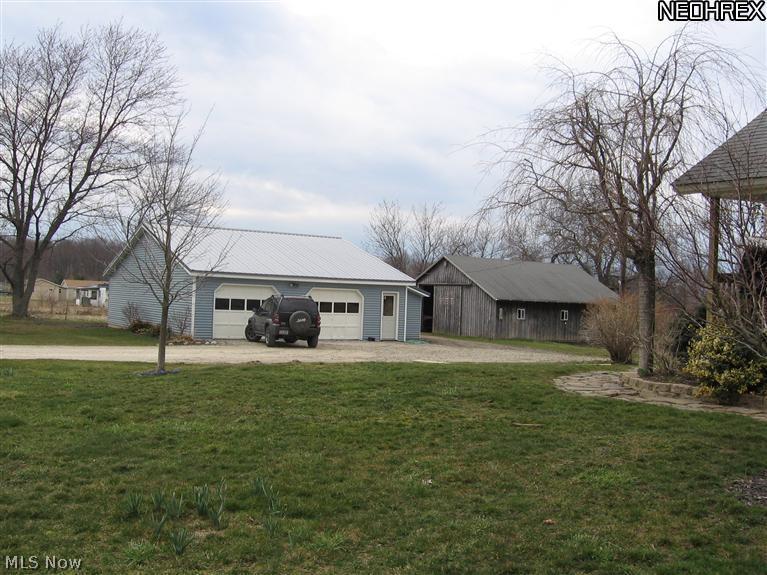 3103 East Maple Road Jefferson, OH 44047 - Photo 10 of 15 View of garage/workshop and barn from front yard.