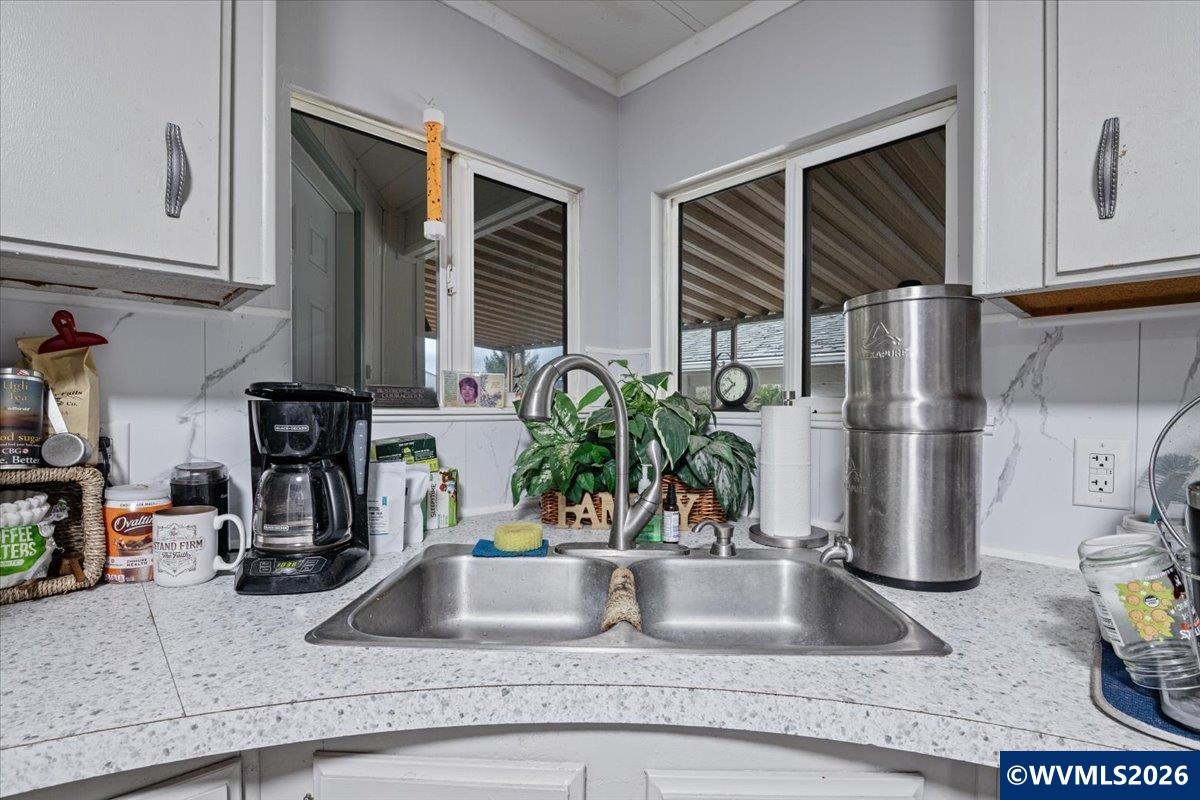5422 Portland Road Northeast, Unit 123 Salem, OR 97305 - Photo 13 of 23 a kitchen with a refrigerator and a sink