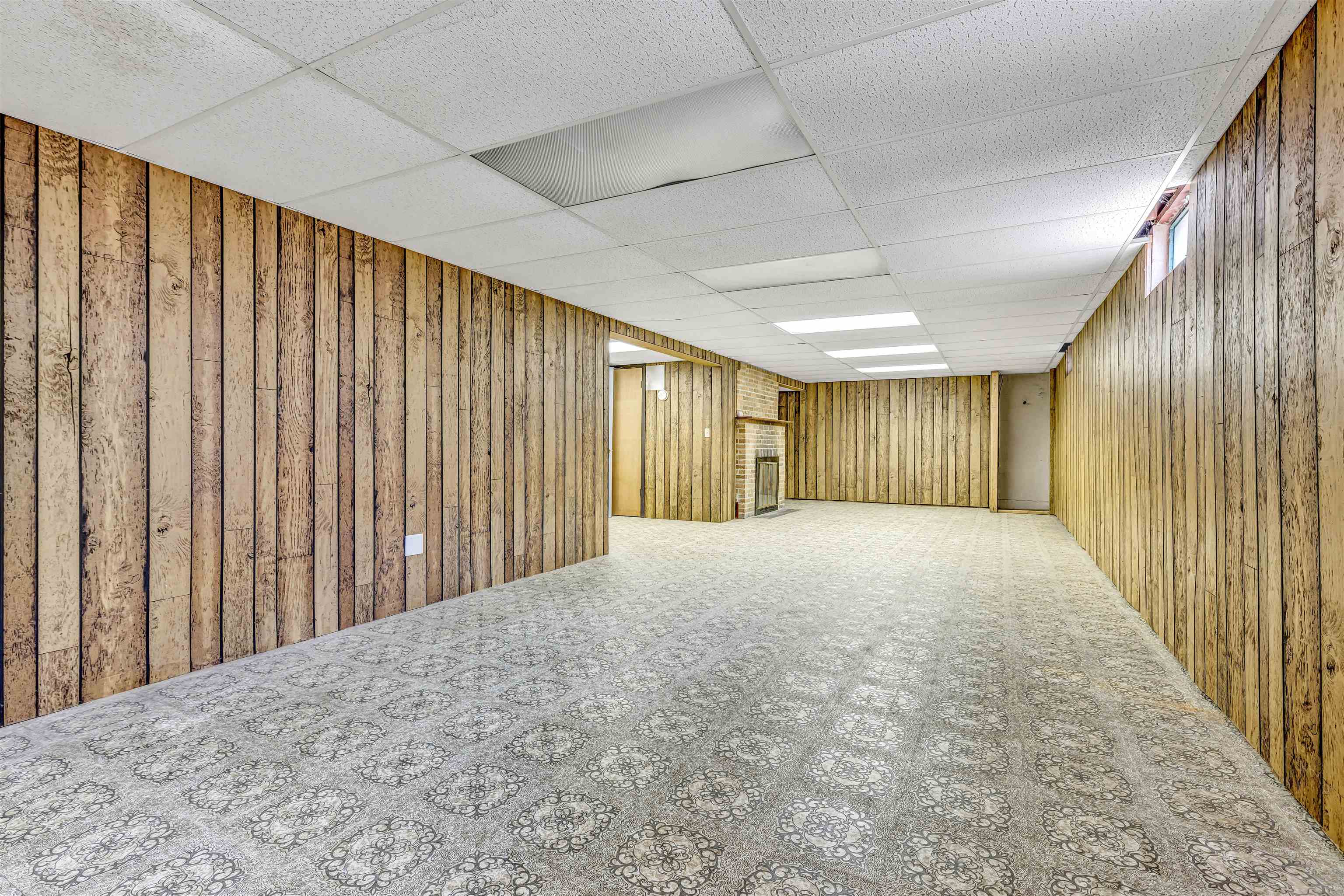 3620 Highcrest Road Rockford, IL 61107 - Photo 12 of 18 a view of a big room with wooden walls
