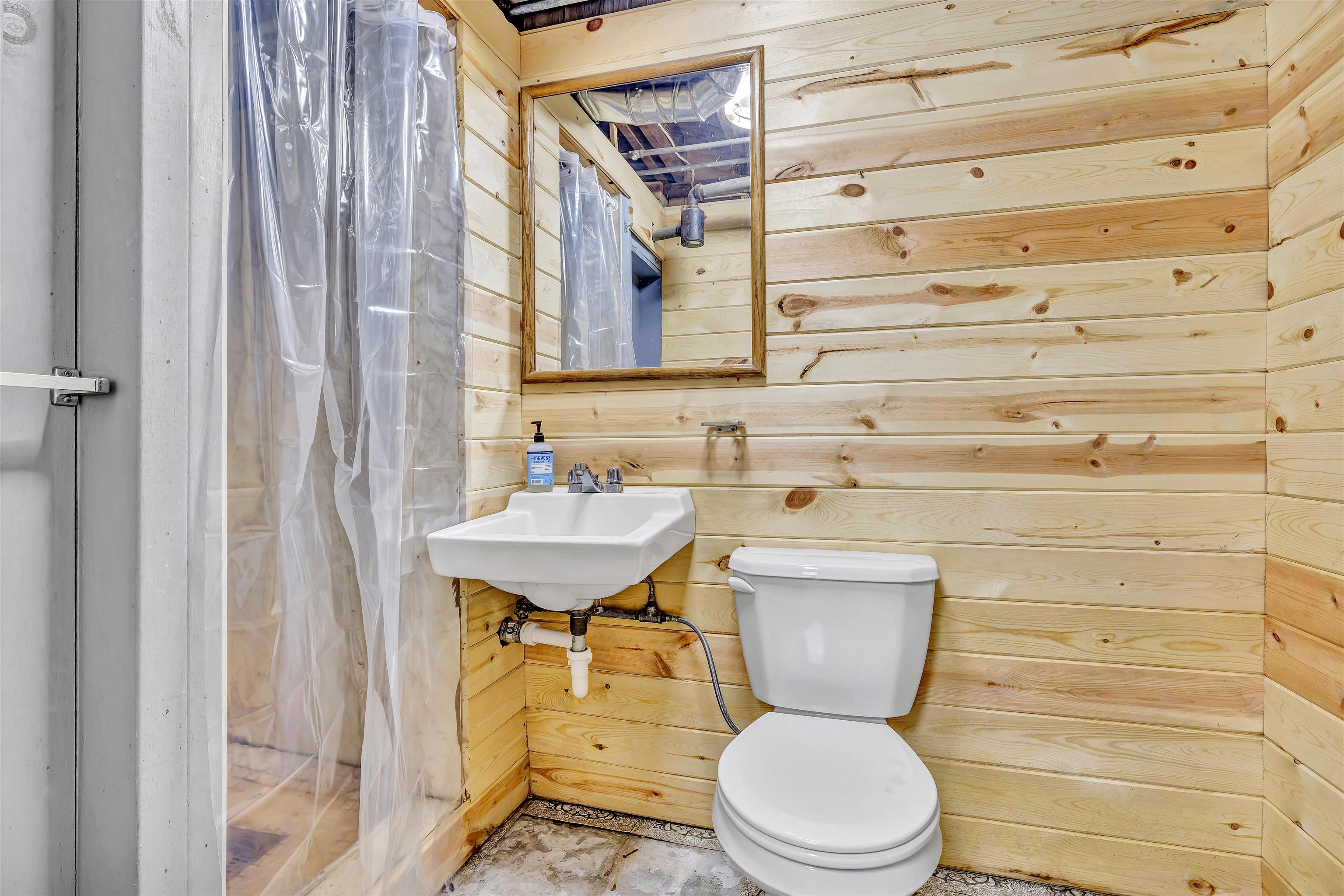 3620 Highcrest Road Rockford, IL 61107 - Photo 13 of 18 a bathroom with a sink a toilet and a mirror