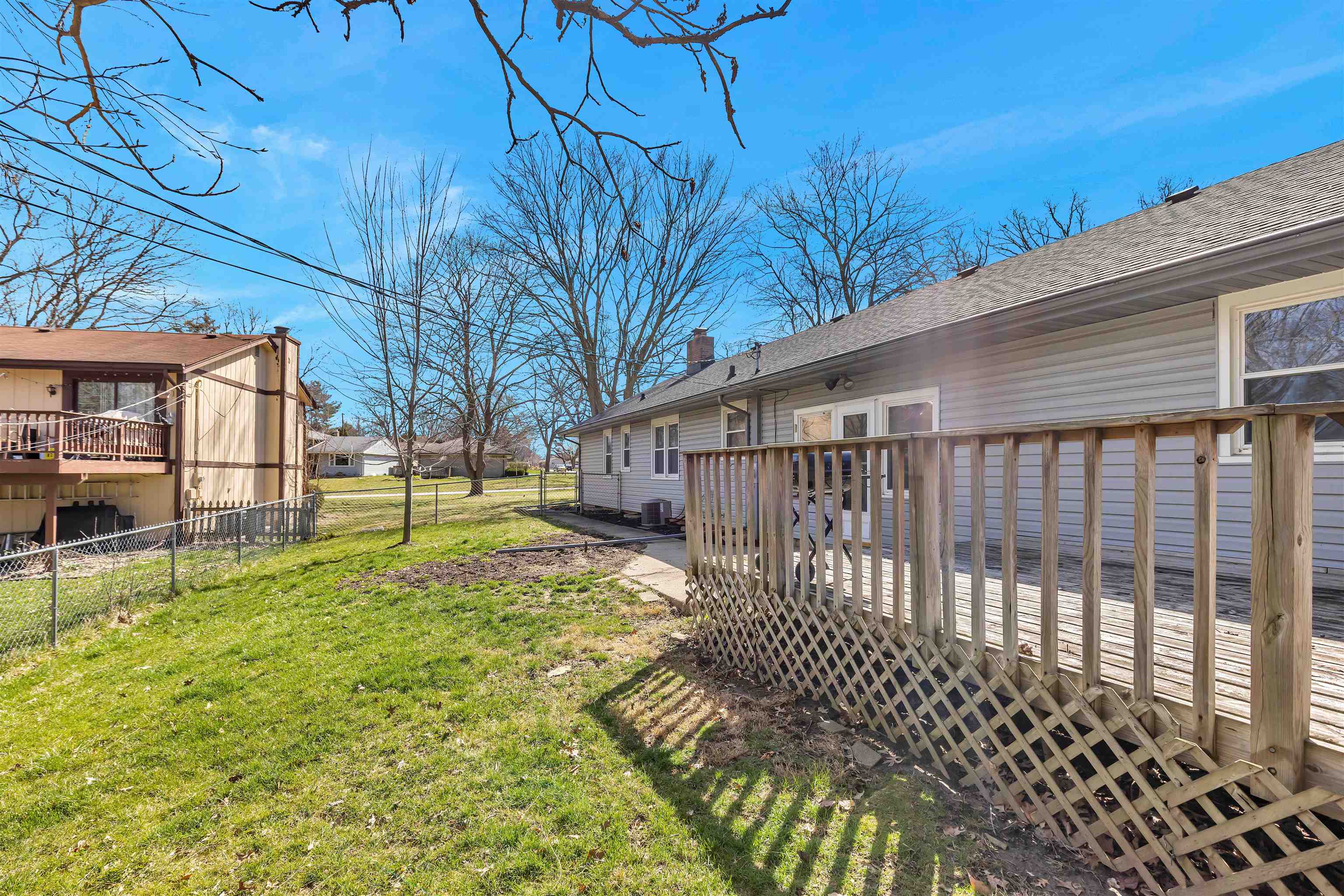 3620 Highcrest Road Rockford, IL 61107 - Photo 18 of 18 a view of a backyard with a large tree