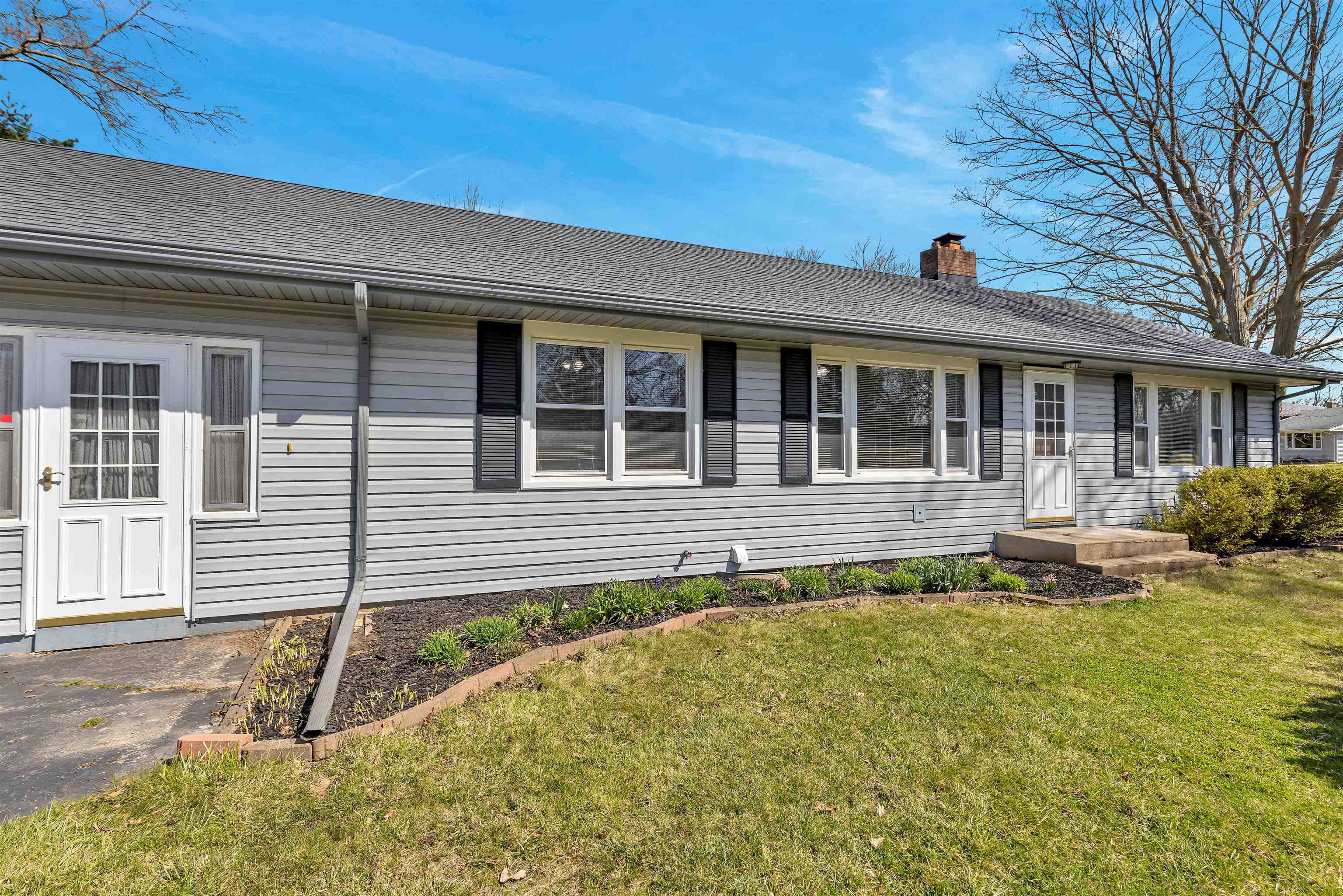 3620 Highcrest Road Rockford, IL 61107 - Photo 2 of 18 front view of a house with a yard