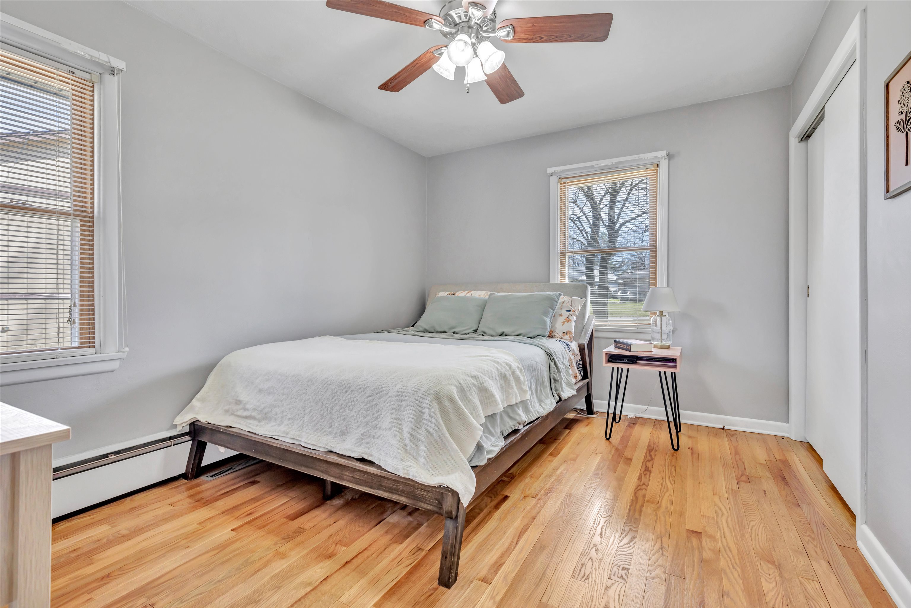 3620 Highcrest Road Rockford, IL 61107 - Photo 9 of 18 a bedroom with a bed and a chandelier