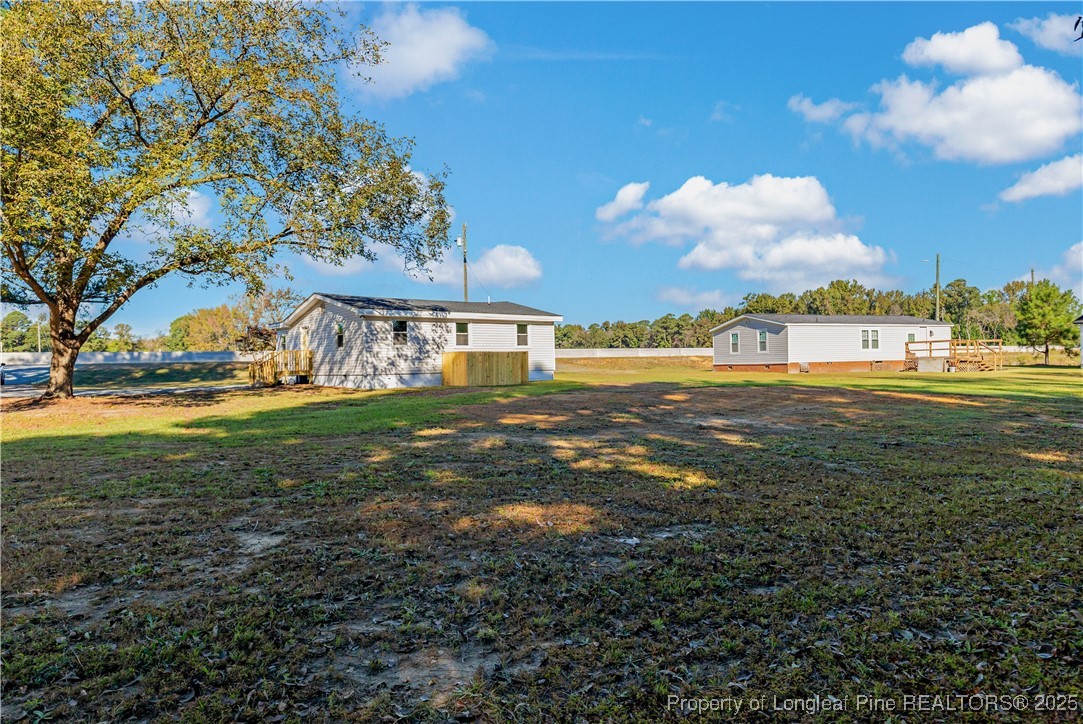 1340 George Perry Lee Road Dunn, NC 28334 - Photo 4 of 31 a view of yard with swimming pool and green space