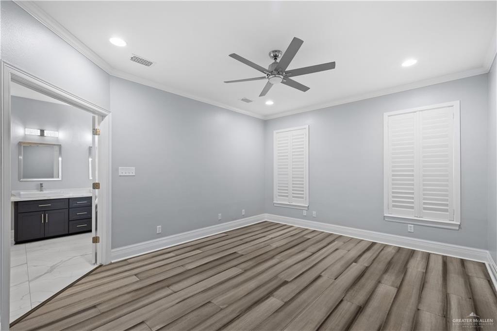 2012 North 46th Street McAllen, TX 78501 - Photo 12 of 41 a view of a livingroom with wooden floor and a ceiling fan