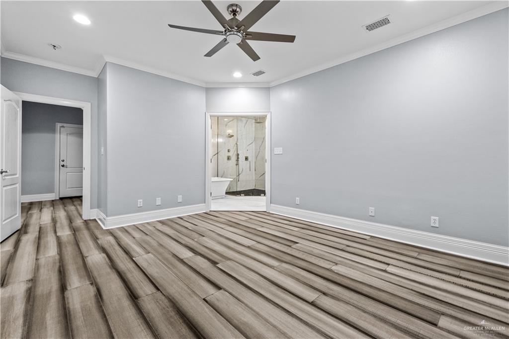 2012 North 46th Street McAllen, TX 78501 - Photo 13 of 41 an empty room with wooden floor closet and windows