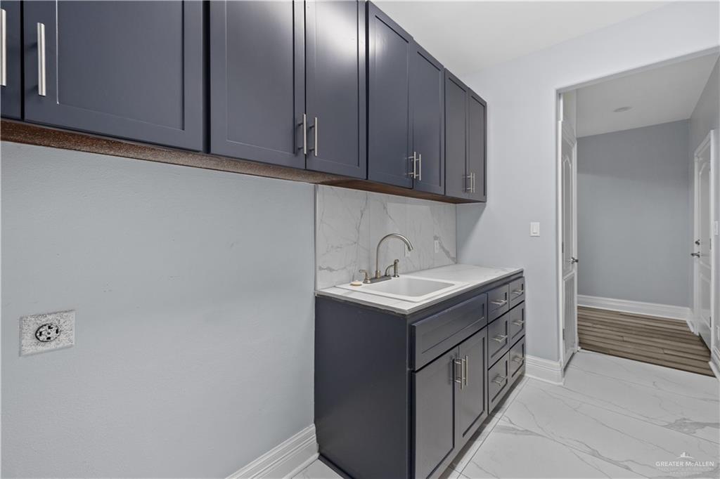 2012 North 46th Street McAllen, TX 78501 - Photo 19 of 41 a utility room with a sink