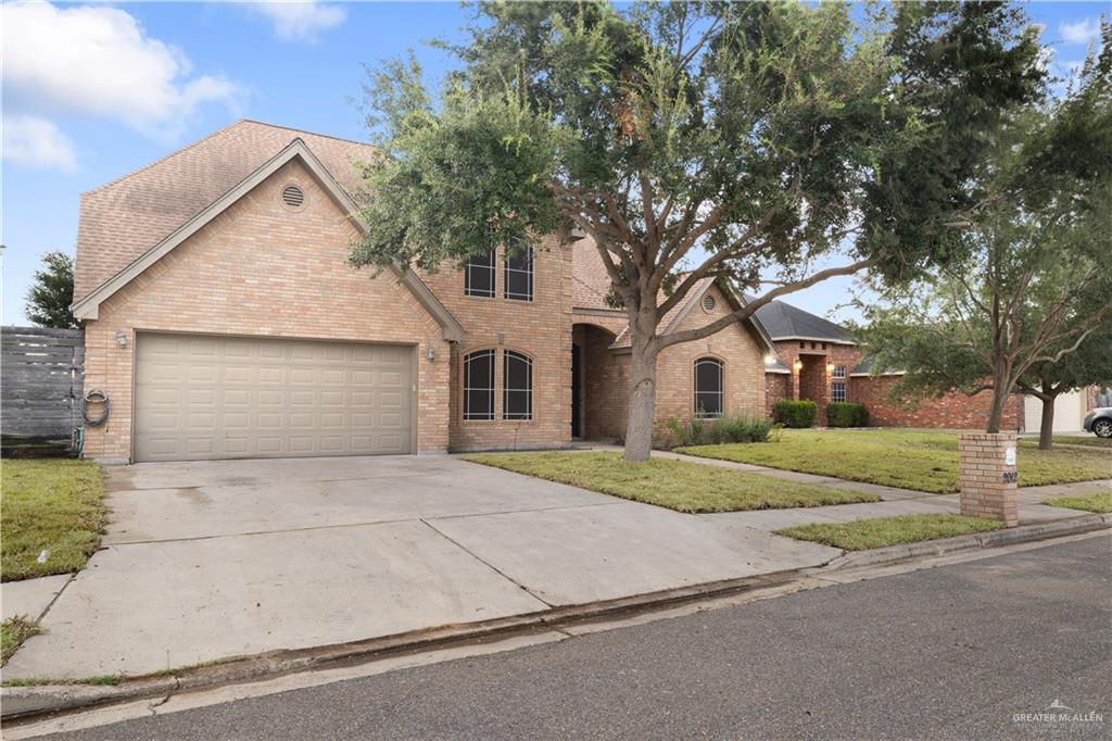 2012 North 46th Street McAllen, TX 78501 - Photo 2 of 41 a front view of a house with a yard and garage