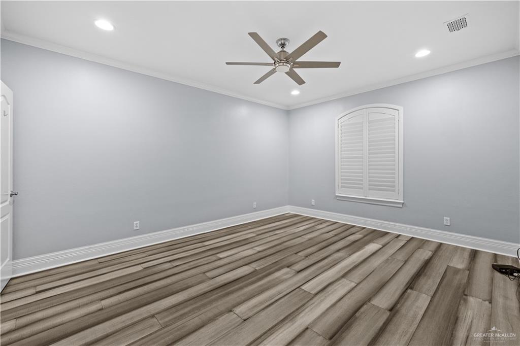 2012 North 46th Street McAllen, TX 78501 - Photo 21 of 41 wooden floor in an empty room with a window