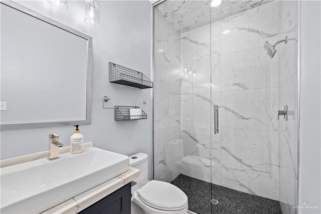 2012 North 46th Street McAllen, TX 78501 - Photo 23 of 41 a bathroom with a sink toilet and shower