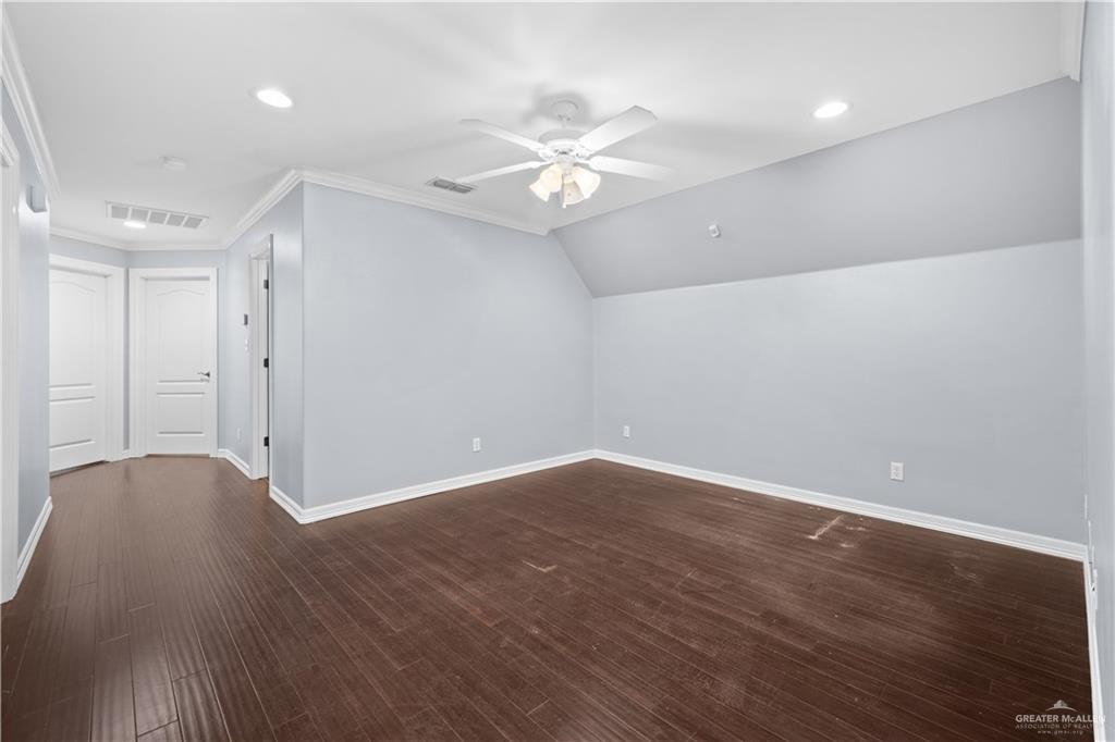 2012 North 46th Street McAllen, TX 78501 - Photo 27 of 41 a view of a room with wooden floor and a ceiling fan