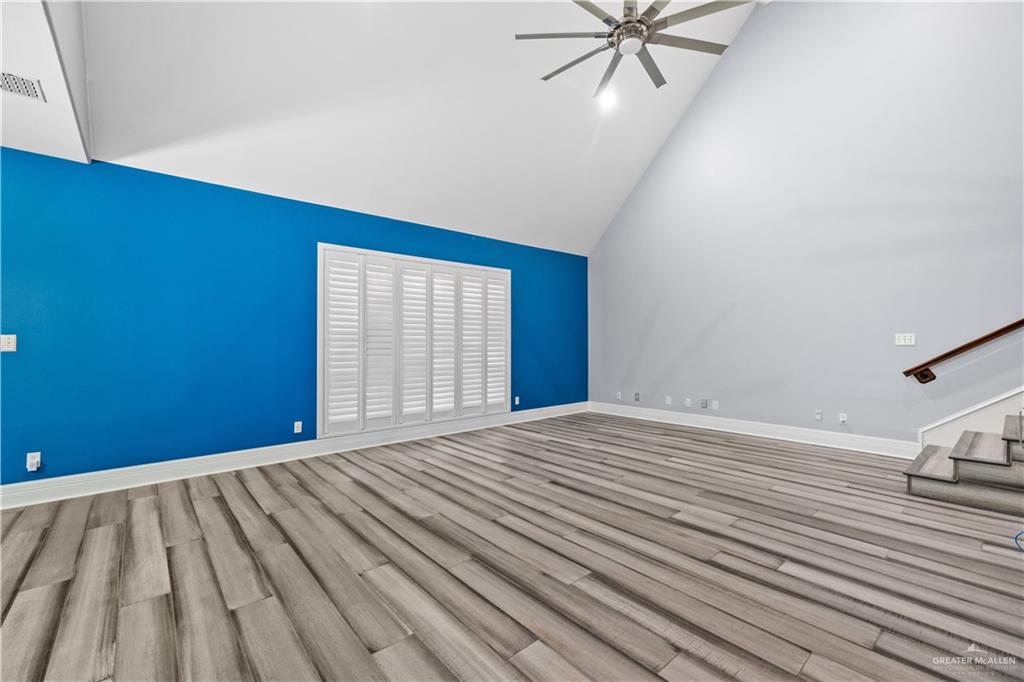 2012 North 46th Street McAllen, TX 78501 - Photo 3 of 41 a view of an empty room with wooden floor and a window