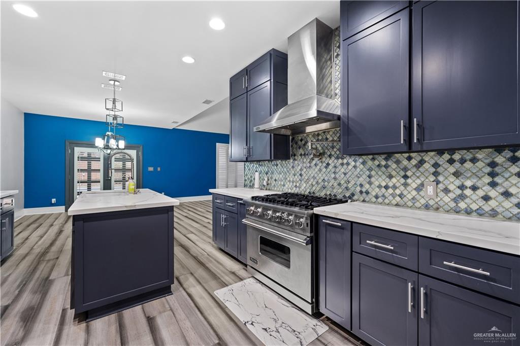 2012 North 46th Street McAllen, TX 78501 - Photo 9 of 41 a kitchen with stainless steel appliances granite countertop a sink stove and refrigerator