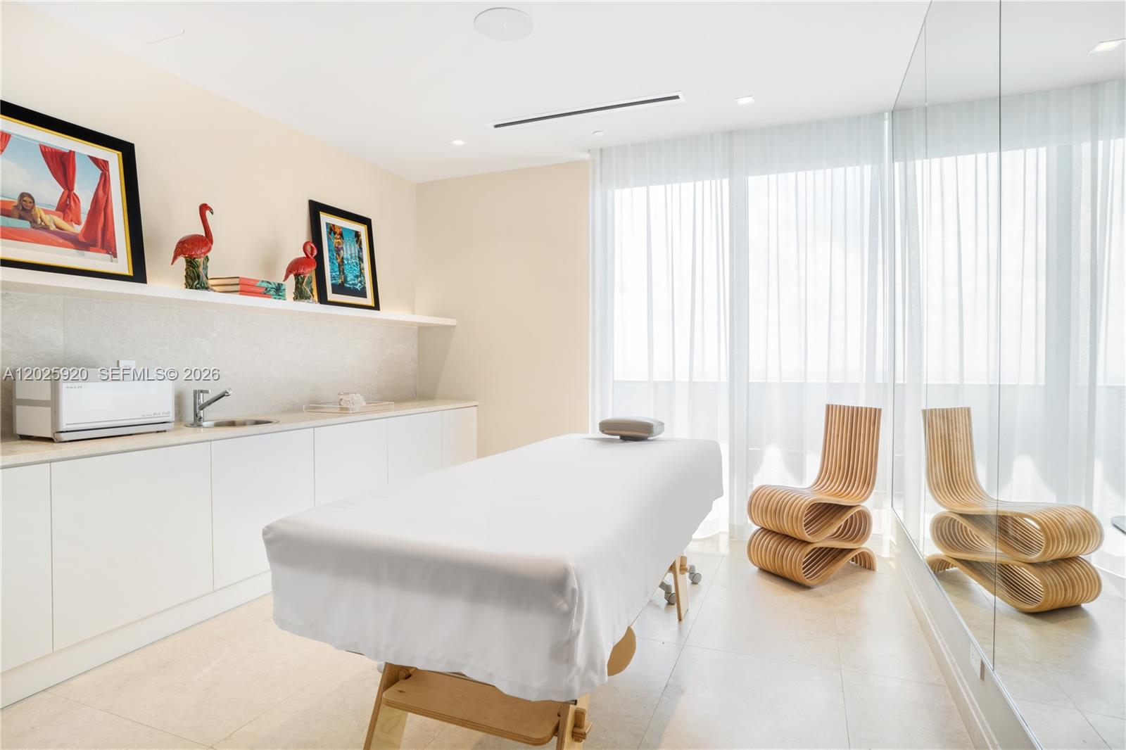 1000 Brickell, Unit 2014 Miami, FL 33131 - Photo 15 of 30 a bedroom with a bed and a large window
