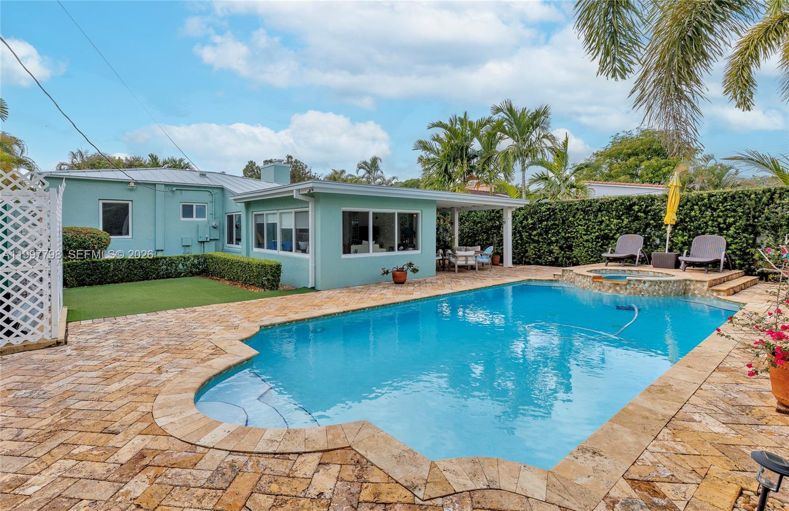 a view of a house with swimming pool