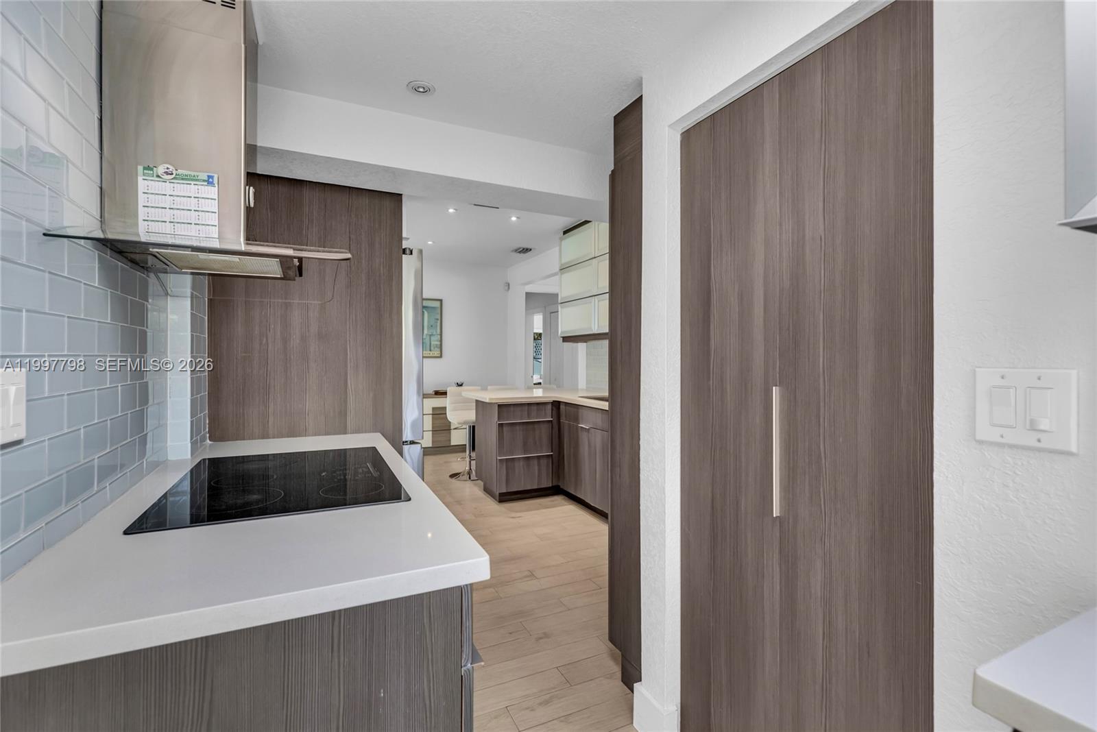 4371 Southwest 13th Terrace Miami, FL 33134 - Photo 15 of 48 a kitchen with a refrigerator and a sink