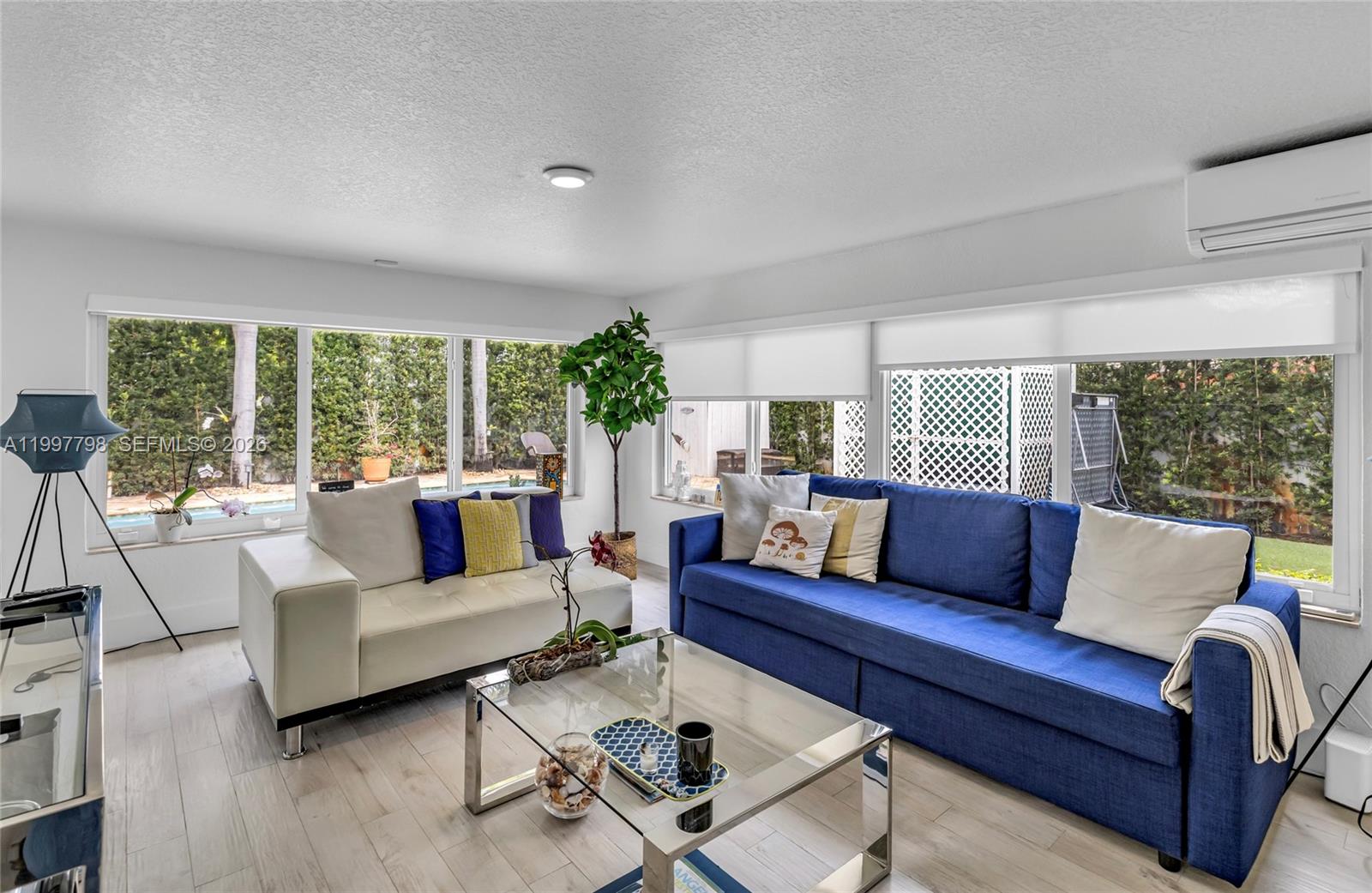 4371 Southwest 13th Terrace Miami, FL 33134 - Photo 23 of 48 a living room with furniture and a large window
