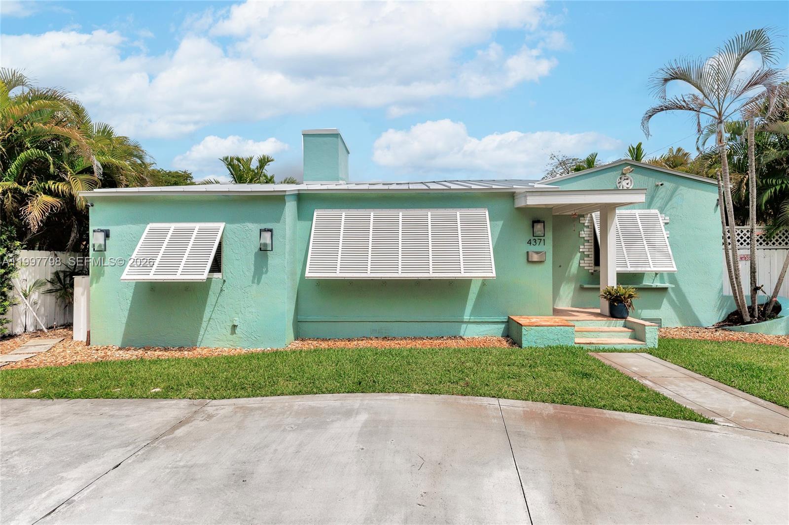 4371 Southwest 13th Terrace Miami, FL 33134 - Photo 37 of 48 front view of a house with a yard