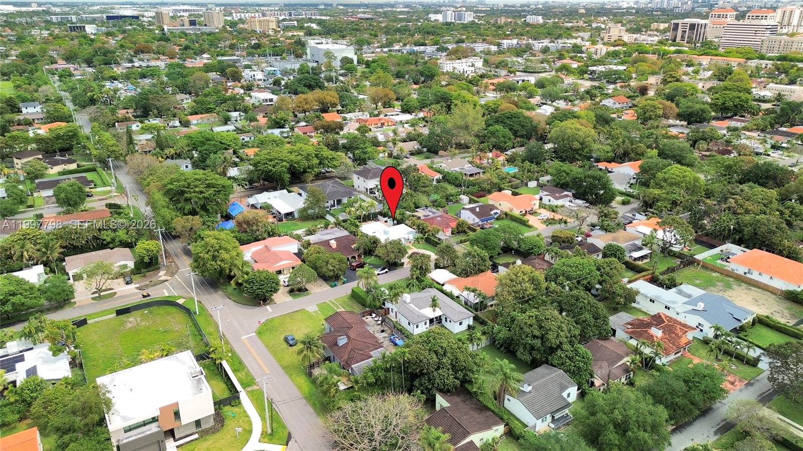4371 Southwest 13th Terrace Miami, FL 33134 - Photo 39 of 48 an aerial view of residential houses with outdoor space and trees