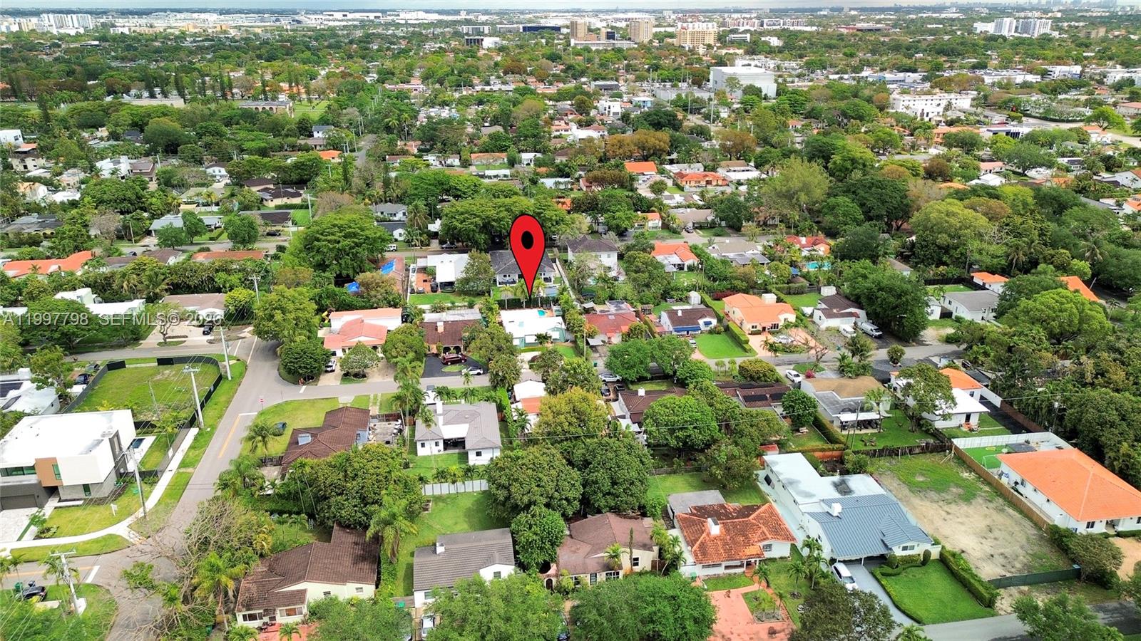 4371 Southwest 13th Terrace Miami, FL 33134 - Photo 40 of 48 an aerial view of residential houses with outdoor space and trees