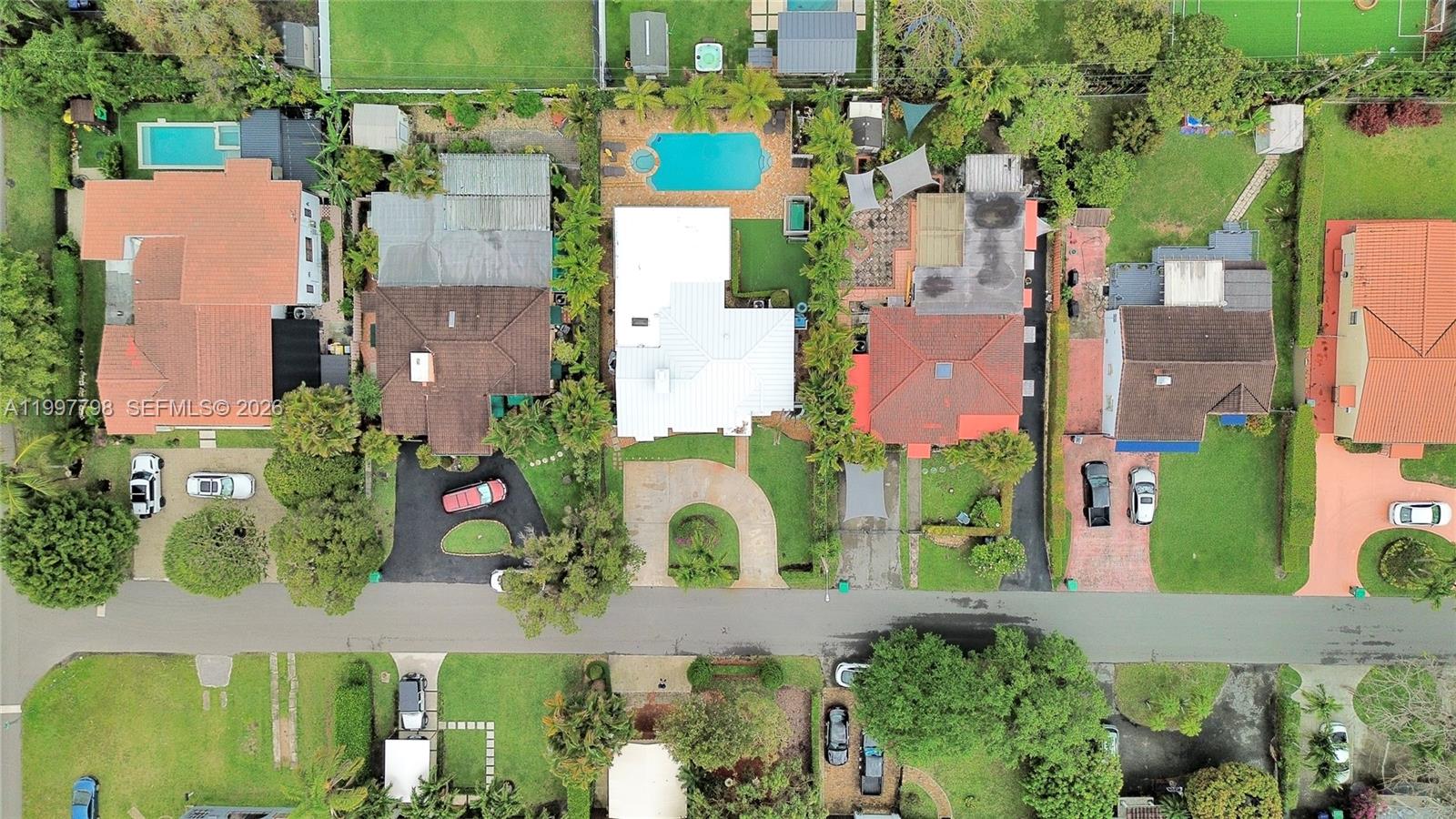 4371 Southwest 13th Terrace Miami, FL 33134 - Photo 41 of 48 an aerial view of multiple houses with a yard