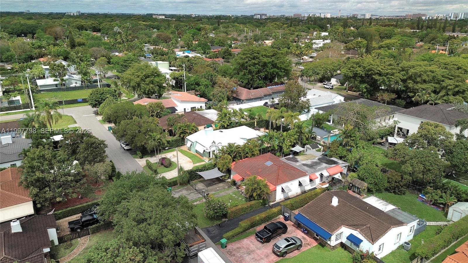 4371 Southwest 13th Terrace Miami, FL 33134 - Photo 46 of 48 an aerial view of residential houses with outdoor space and trees