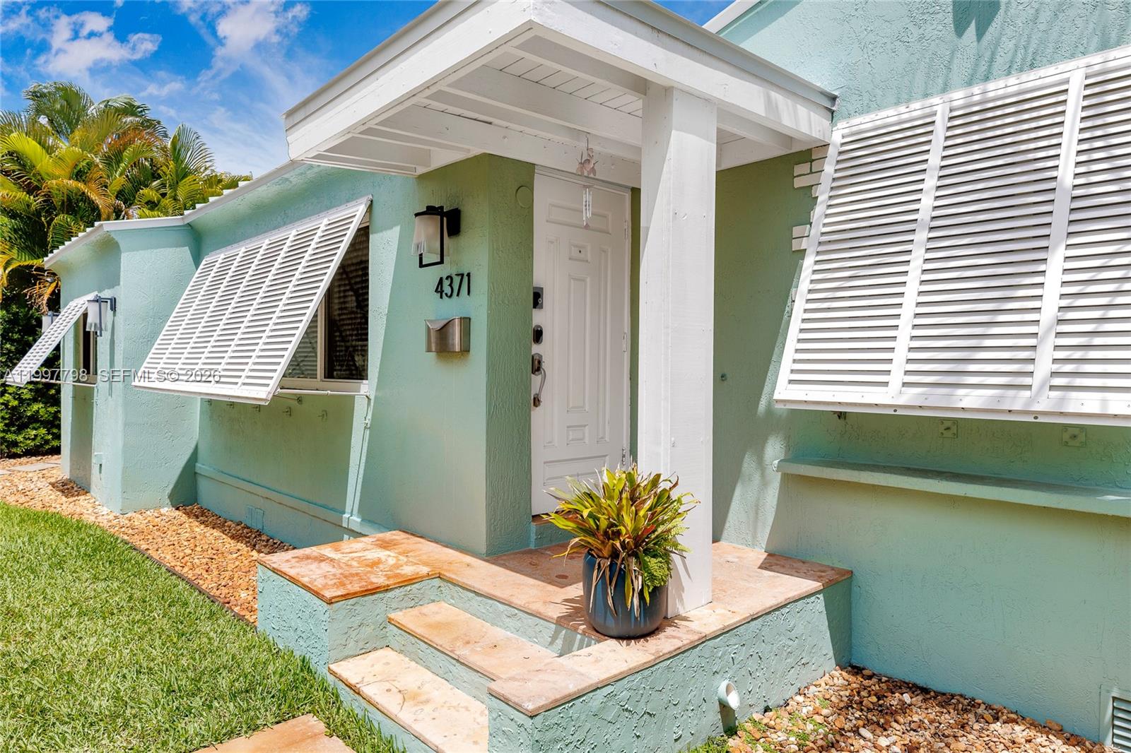4371 Southwest 13th Terrace Miami, FL 33134 - Photo 5 of 48 a backyard of a house with outdoor seating