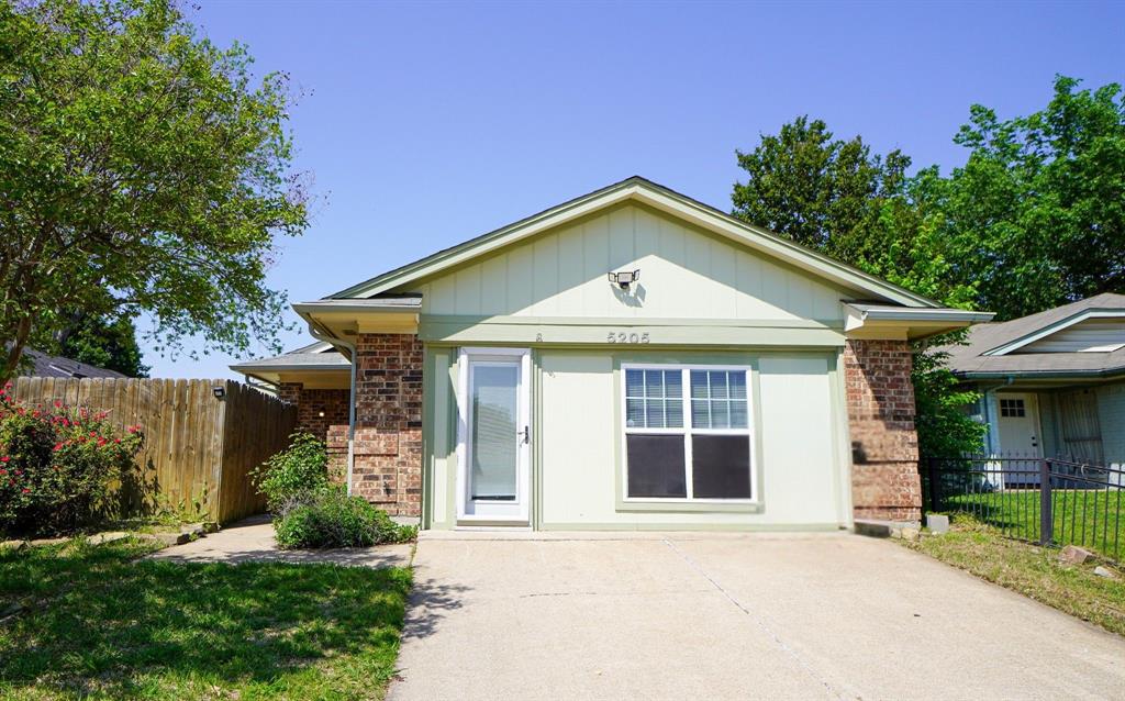 5205 Shoregate Drive Garland, TX 75043 - Photo 1 of 18 front view of a house with a yard