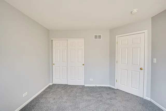 a view of an empty room and entryway