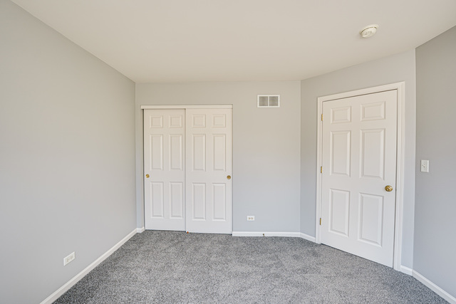 3379 Kentshire Circle, Unit 3379 Aurora, IL 60504 - Photo 12 of 17 a view of an empty room and entryway
