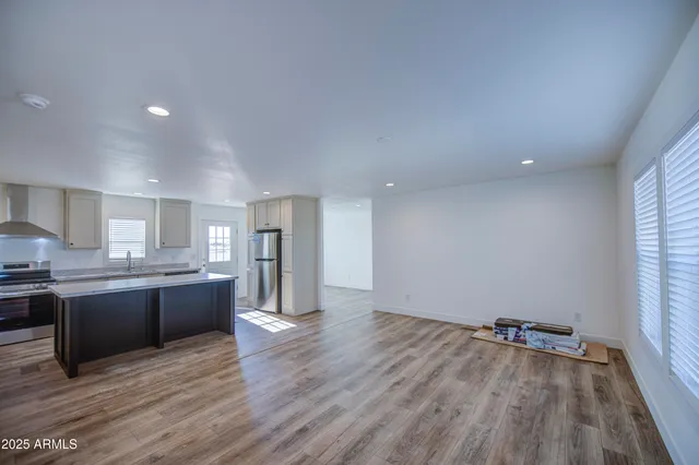 a view of kitchen and kitchen with wooden floor