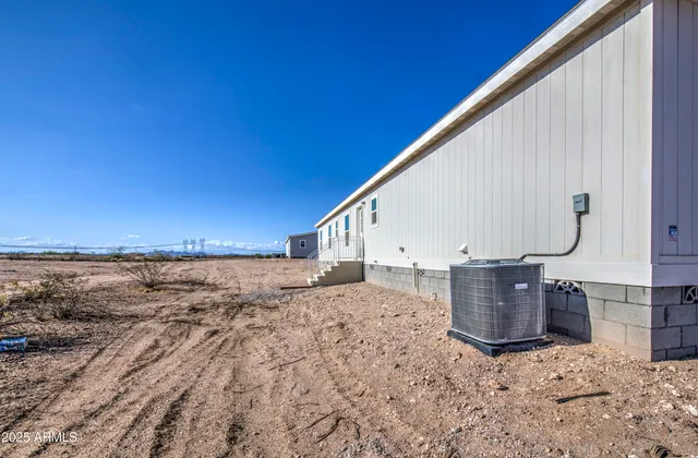 a view of roof with wooden wall and seating space