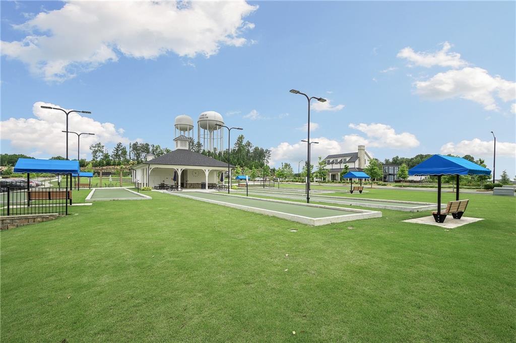 2426 Naples Street Hoschton, GA 30548 - Photo 2 of 11 a view of a park with a large tree