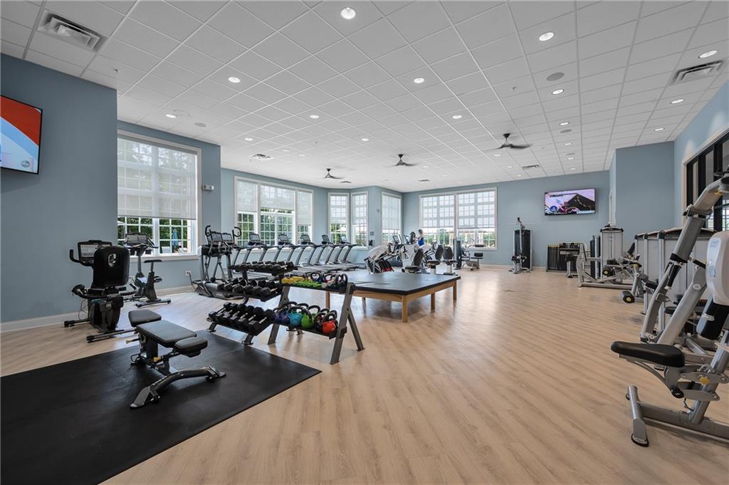 2426 Naples Street Hoschton, GA 30548 - Photo 5 of 11 a view of a room with gym equipment and a large window