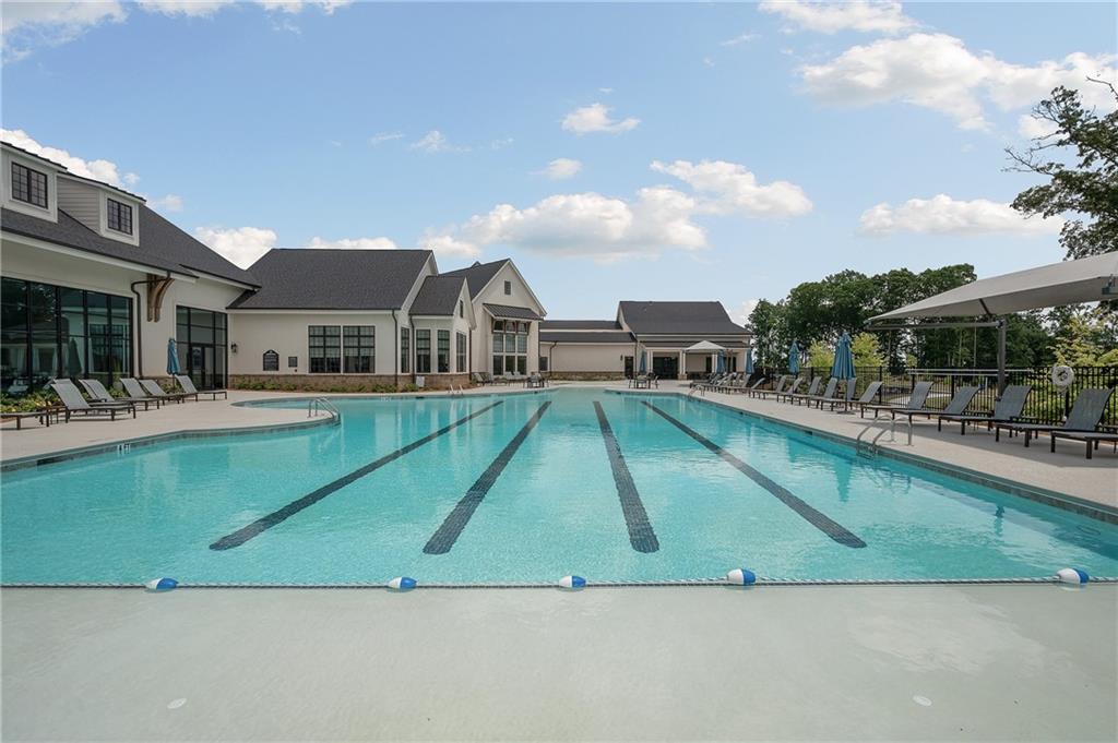 2426 Naples Street Hoschton, GA 30548 - Photo 6 of 11 a view of a house with pool