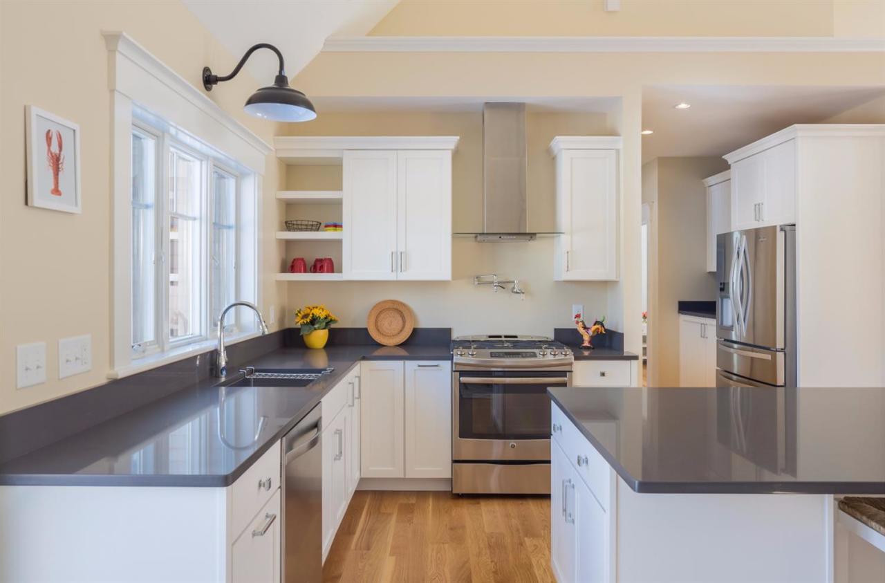 900 Massasoit Road Eastham, MA 02642 - Photo 18 of 21 a kitchen with a sink a stove a refrigerator and a refrigerator