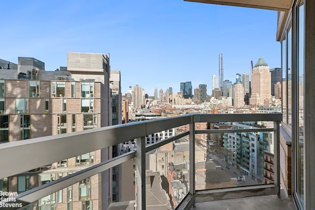 a view of a balcony with city