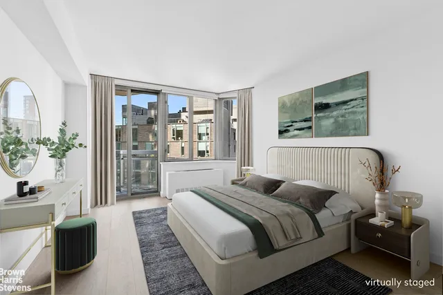 a bedroom with bed and glass door