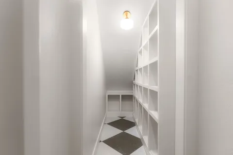 a view of staircase with white walls