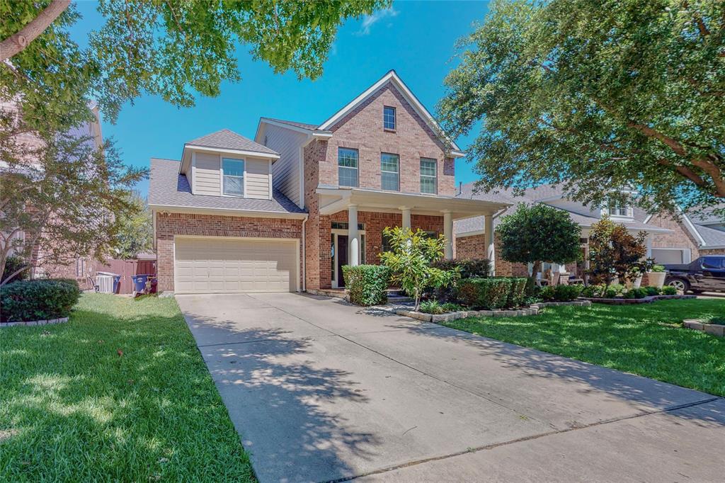 2855 Coteau Way Dallas, TX 75227 - Photo 2 of 35 a front view of a house with a yard and garage