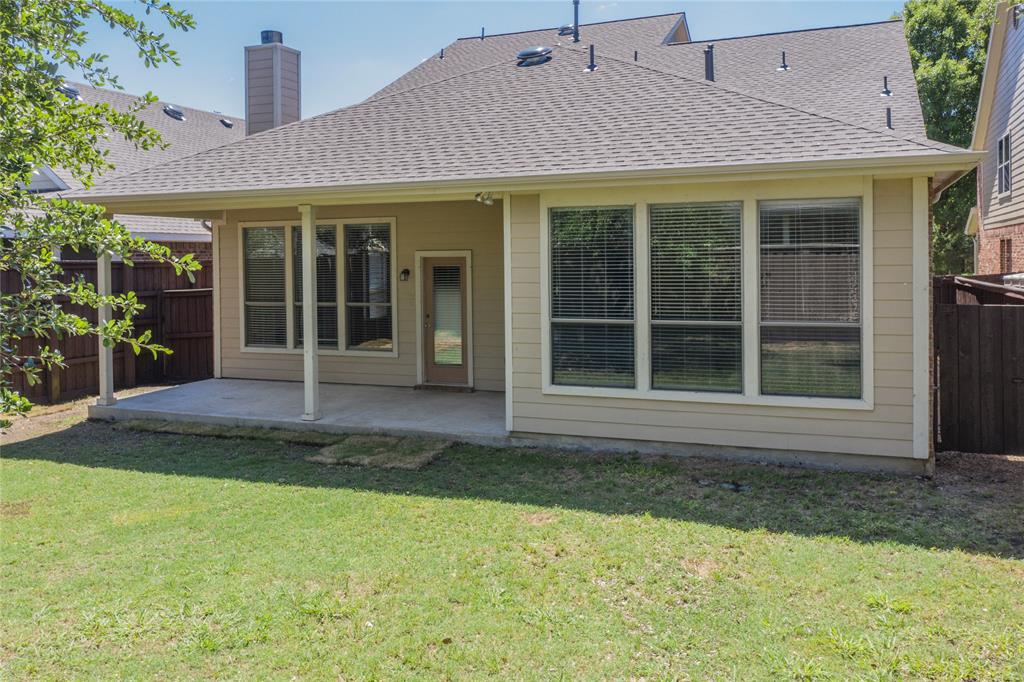 2855 Coteau Way Dallas, TX 75227 - Photo 29 of 35 a front view of a house with a yard
