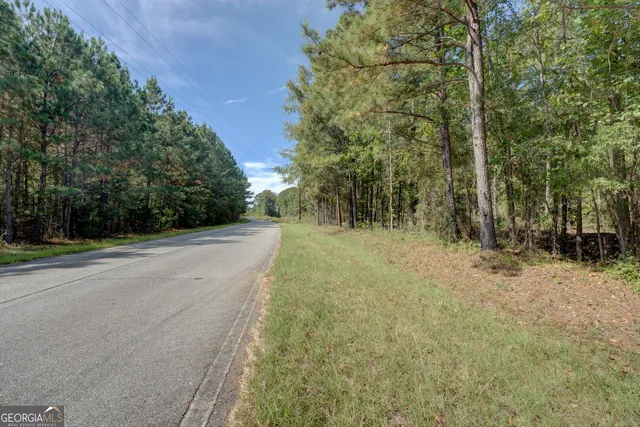 a kitchen with stainless steel appliances granite countertop a sink refrigerator and cabinets